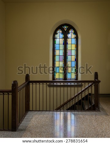 HOLLAND, MICHIGAN - MAY 13: Stained glass window above staircase in the Dimnent Memorial Chapel on the campus of Hope College on May 13, 2015 in Holland, Michigan
