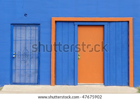Blue building with orange trim and door