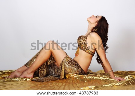Eastern dancer in a gold suit
