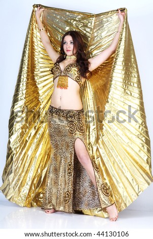 Beautiful young girl in a gold suit
