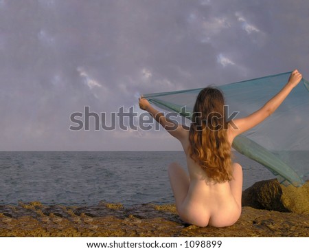 stock photo nature girlsitting nude on a rockfacing the sea with