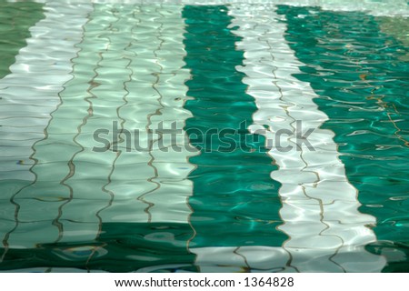 green pool with tiles and reflections and clean water