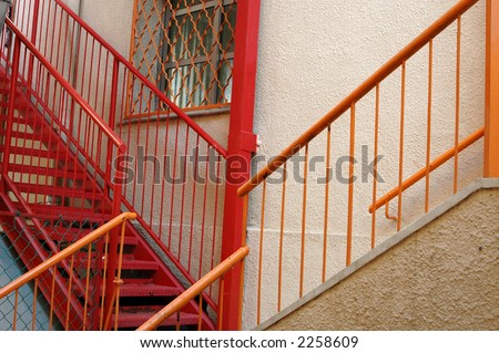 red metal stairs and window