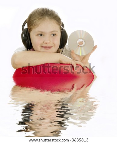 the girl teenager in headphones. Reflection in water.