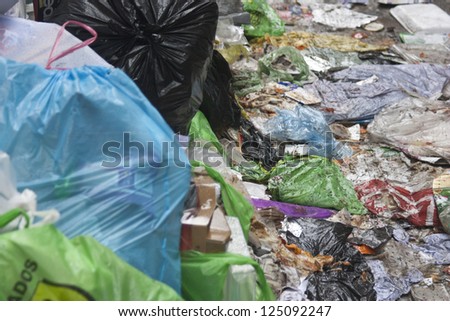 a lot of garbage in the street and waste