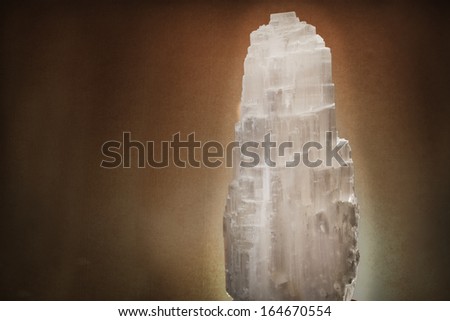 white salt lamp isolated on brown