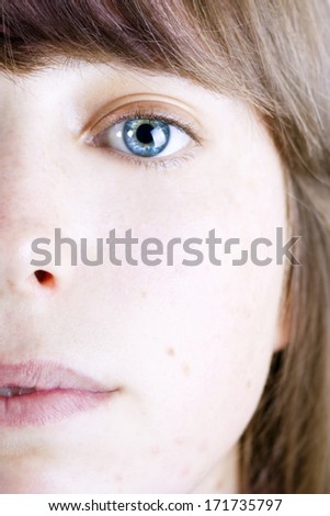 Woman portrait with impressive blue eye.