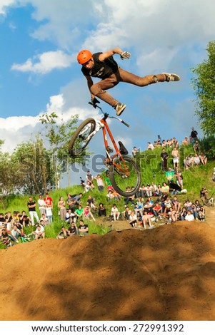 MOSCOW - JUNE 06: biker is making stunt at his mountain bike at Pit Jam contest, June 06, 2011 in Moscow, Russia