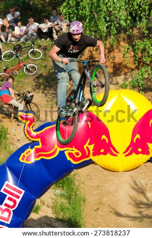 Moscow, Russia, June 06. Biker is making stunt at his mountain bike at Pit Jam contest, June 06, 2011 in Moscow, Russia