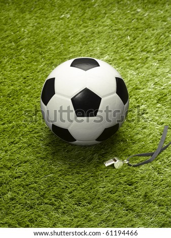 ball and whistle on soccer field
