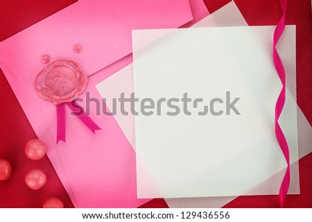 Paper card and pink envelope with sealing wax stamp