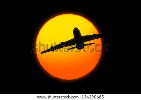 Beautiful sunset with airplane on black background