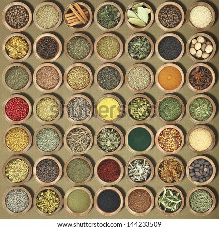 Large collection of metal bowls full of herbs and spices
