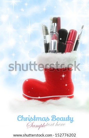 Santa Claus boot stuffed with woman cosmetics