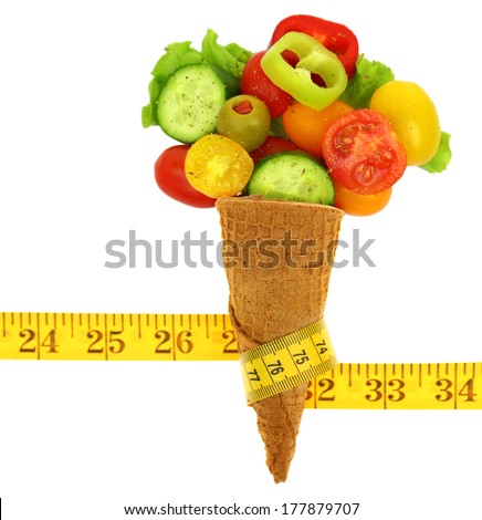 Fresh mixed vegetables on ice cream cone with a tape measure Fresh mixed vegetables on ice cream cone with a tape measure