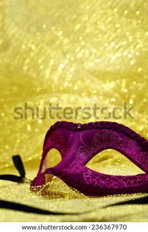Vintage carnival mask in golden background with copy space