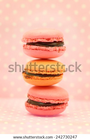 Traditional french colorful macaroons on pink retro background