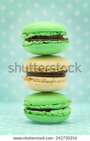 Traditional french colorful macaroons on blue retro background