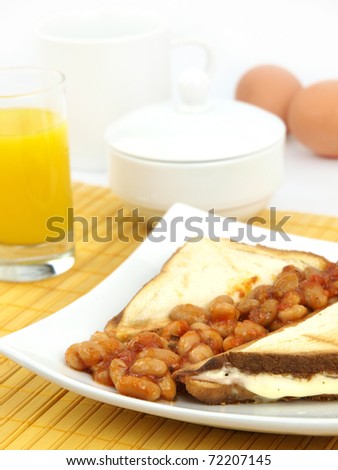 Close up of a plate of baked beans on toast