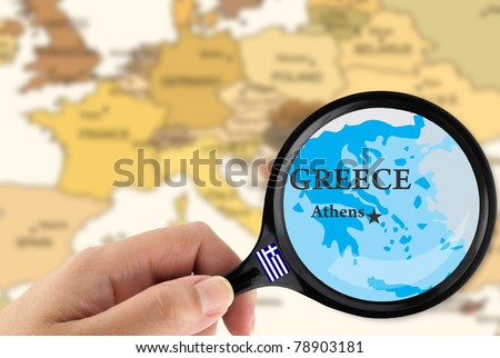 Magnifying glass over a map of Greece