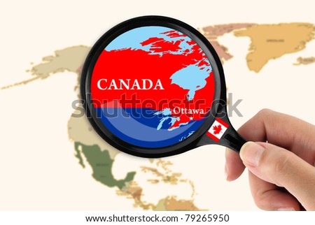 Magnifying glass over a map of Canada
