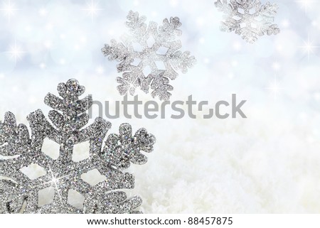 Snowflake on the snow background