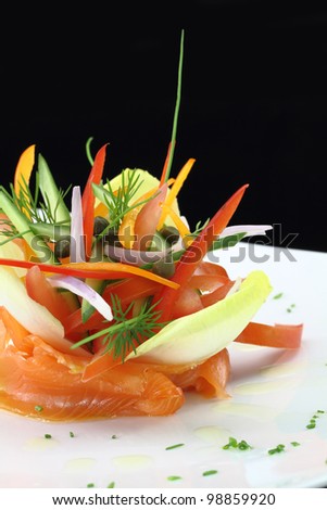 Gourmet dish. Smoked salmon with vegetables