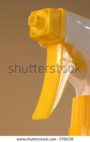 Yellow spray nozzle, macro of the nozzle and trigger.