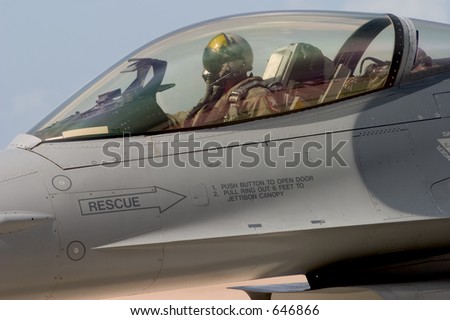 An F-16 pilot prepares to taxi out to the runway for take-off, at the 50th Anniversary Miramar Air Show, California.