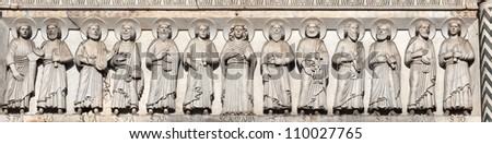 Hi-res closeup of the engraving of the Disciples of Christ on the 12th century Cathedral of St Martin in Lucca, Italy