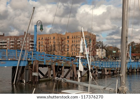 BROOKLYN, NEW YORK - OCTOBER 30: Sunken yachts and the damaged Ocean Avenue bridge in the aftermath of the Superstorm Sandy on October 30, 2012 in the Sheepshead Bay, Brooklyn, New York, USA.