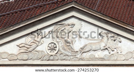 Milan\'s La Scala Neoclassical frontage surmounted by a tympanum featuring a bas-relief of Apollo, protector of the Muses, and his Chariot