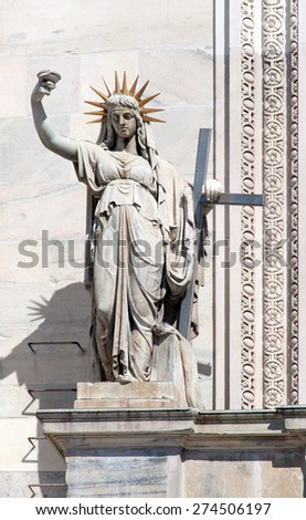 Statue on the Milan Cathedral\'s facade, representing the New Law carved by Camillo Pacetti in 1810 inspired Frederic Auguste Bartholdi for the construction of the Statue Of Liberty in NYC