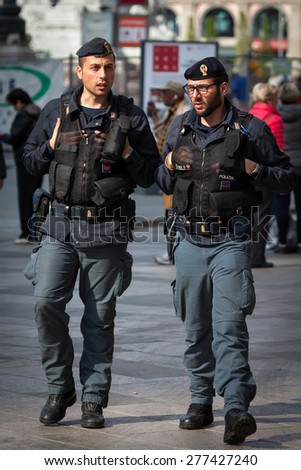 MILAN, ITALY - APRIL 7 2015: Italian State Police is the main force for providing police duties, responsible for highway patrol, railways, airports and customs.