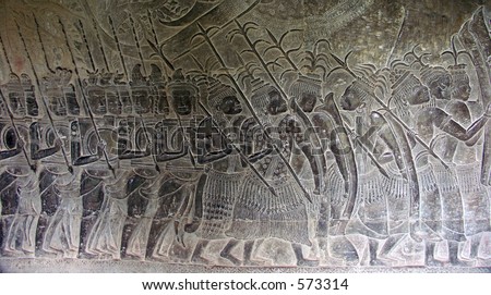 Thai soldiers on the march against Khmer empire - stone engravings on the walls of the Angkor Wat Temple in Siem Reap, Cambodia