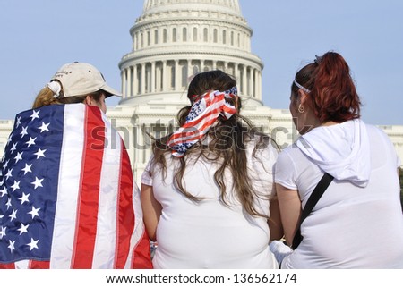 Washington D.C. - April 10: Demonstrators Show Their American Patriotism In Front Of The Capitol During A Demonstration For Immigration Reform In Washington D.C. On April 10, 2013.
