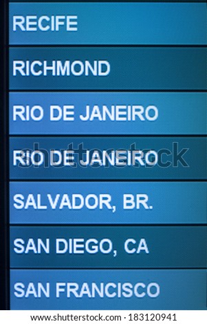 Airline scheduled flight destinations on monitor in airport lists Recife, Richmond, Rio de Janeiro, Salvador, San Diego, and San Francisco on screen