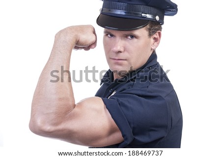 Male police officer in blue uniform flexes arm to show power of the law on white background
