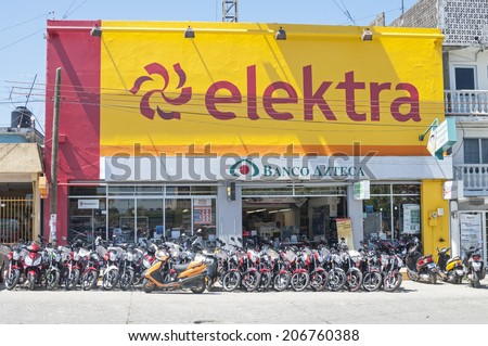 LAS CHOAPAS, MEXICO - JULY 17, 2014: Elektra is a massive chain of stores offering electronics, appliances, motorcycles and banking.  This one displays their line of economy motorcycles.