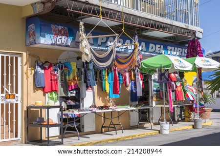 BOQUERON, PUERTO RICO, USA - JANUARY 17, 2014: Tourist shop on street corner in Boqueron on west coast of Puerto Rico offers colorful variety of souvenirs for tourists.