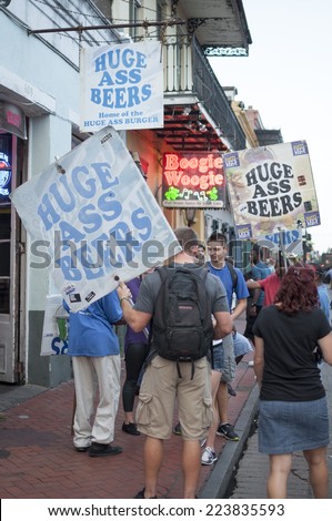 NEW ORLEANS, USA - OCTOBER 10, 2014: Beer promoters carry \