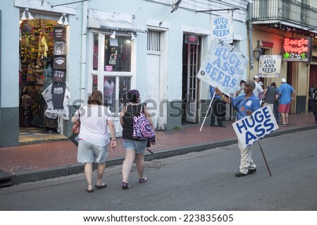 NEW ORLEANS, USA - OCTOBER 10, 2014: Beer promoter carries \