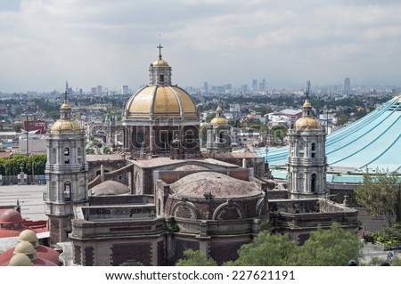 MEXICO CITY, MEXICO - OCTOBER 23, 2014: From Tepeyac Hill a good view is had of the old and new Basilica of Our Lady of Guadalupe as well as the Mexico City skyline in the distance.