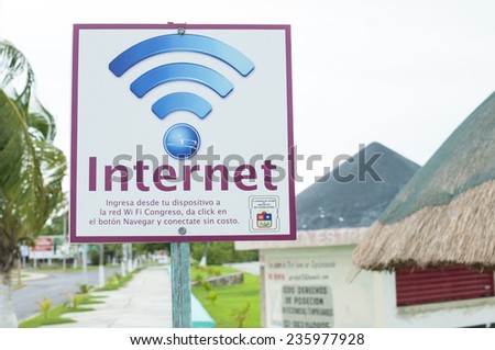 CHETUMAL, MEXICO - OCTOBER 8, 2014: Free good quality wifi internet connection is available outdoors in a park next to Chetumal Bay across the street from the State Congress