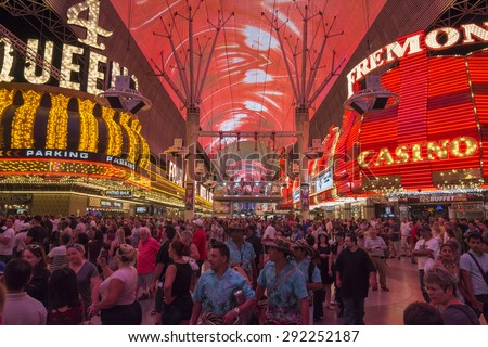 LAS VEGAS, USA - MAY 28, 2015: Huge crowds of tourists gather under the world\'s largest video screen to enjoy live entertainment, beer, food and casinos at the Fremont Street Experience in Las Vegas