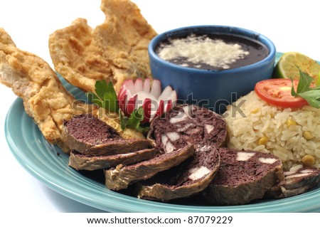 Plate of moronga (goat\'s blood) and chicharrones with rice and beans