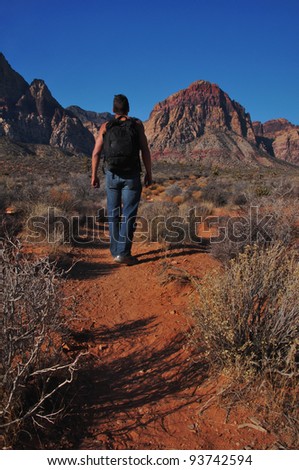 Man hiking in desert in Red Rock canyon Las Vegas