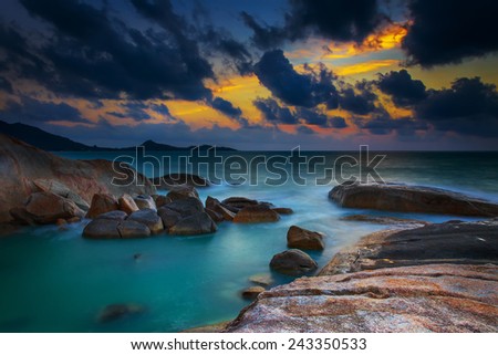 Sunrise and a morning twilight on the rocks in a tropical island