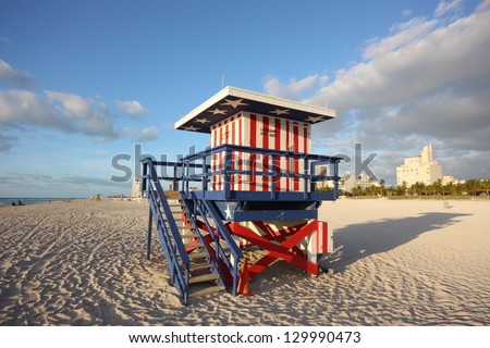 Lifeguard station/hut on Miami beach, Florida at sunrise. USA Painted with famous red, white and blue colours of the American flag.
