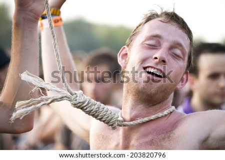 Budapest, Hungary - August 11th 2010: A guy with a hangman noose around his neck dancing at Sziget Festival